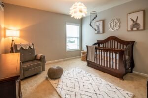Wooden baby crib in a bright nursery