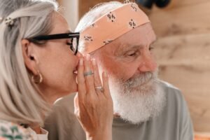 Woman whispering into a man's ear